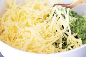 grated cheese and broccoli in bowl