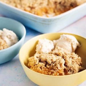 apple and sweet potato crumble in dish and bowls