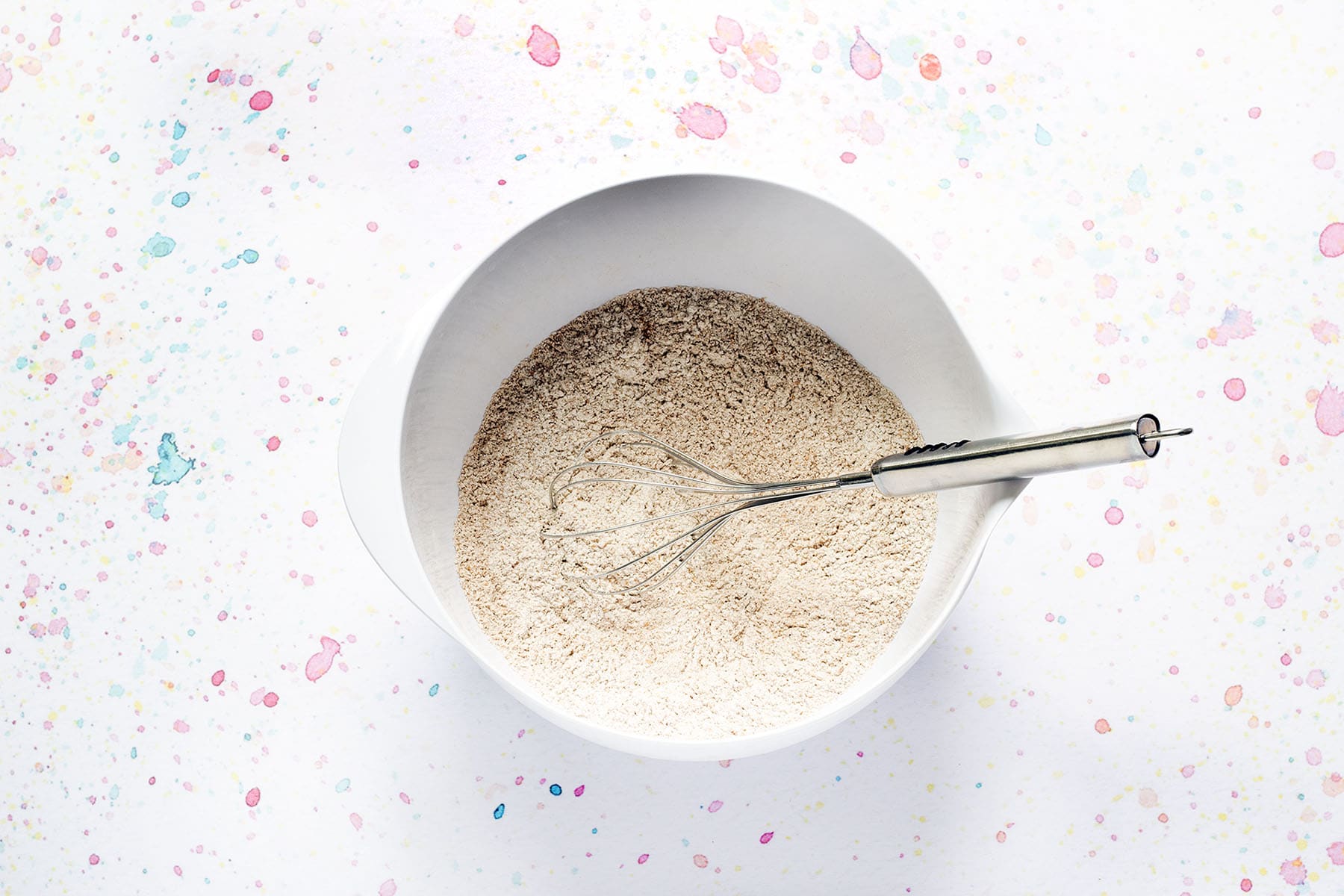 whisked flour, spices and baking powder in white bowl