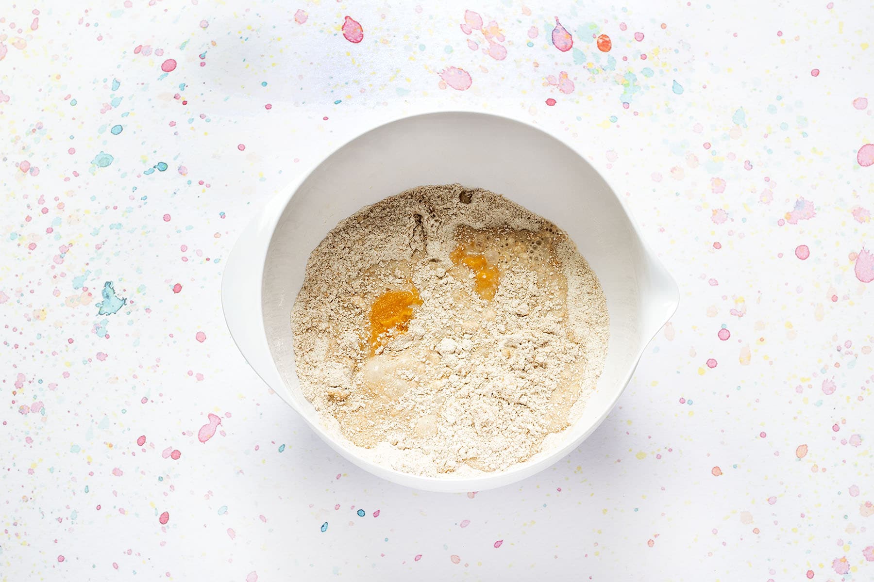 flour with milk and sweet potato purée in white bowl