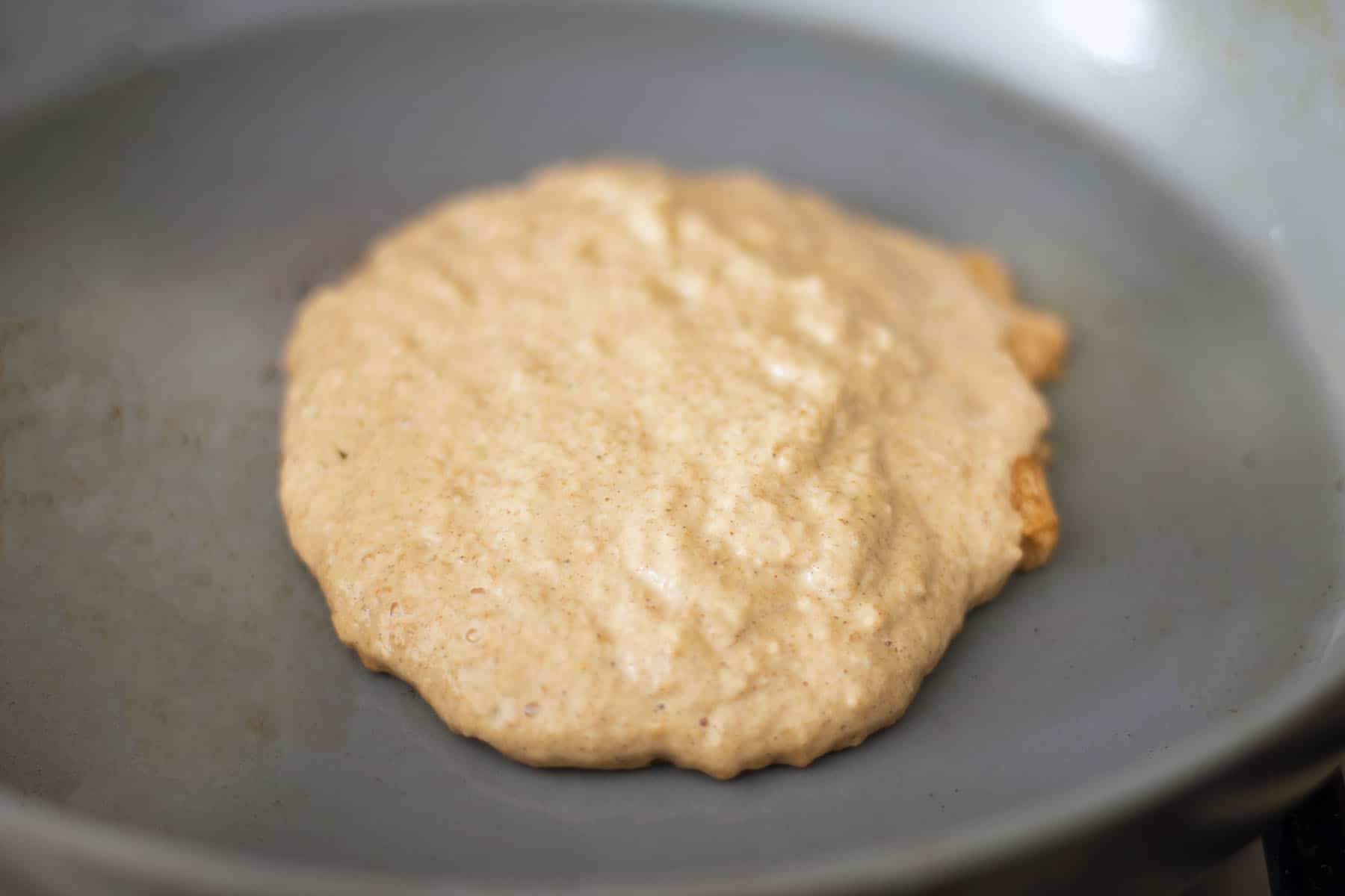 uncooked sweet potato pancake on pan
