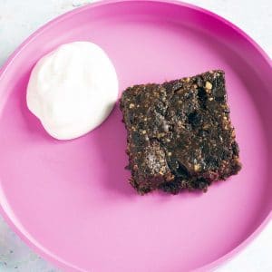 raw brownies on pink plate
