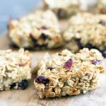 apple, cherry and celeriac flapjacks cut into squares on wooden board
