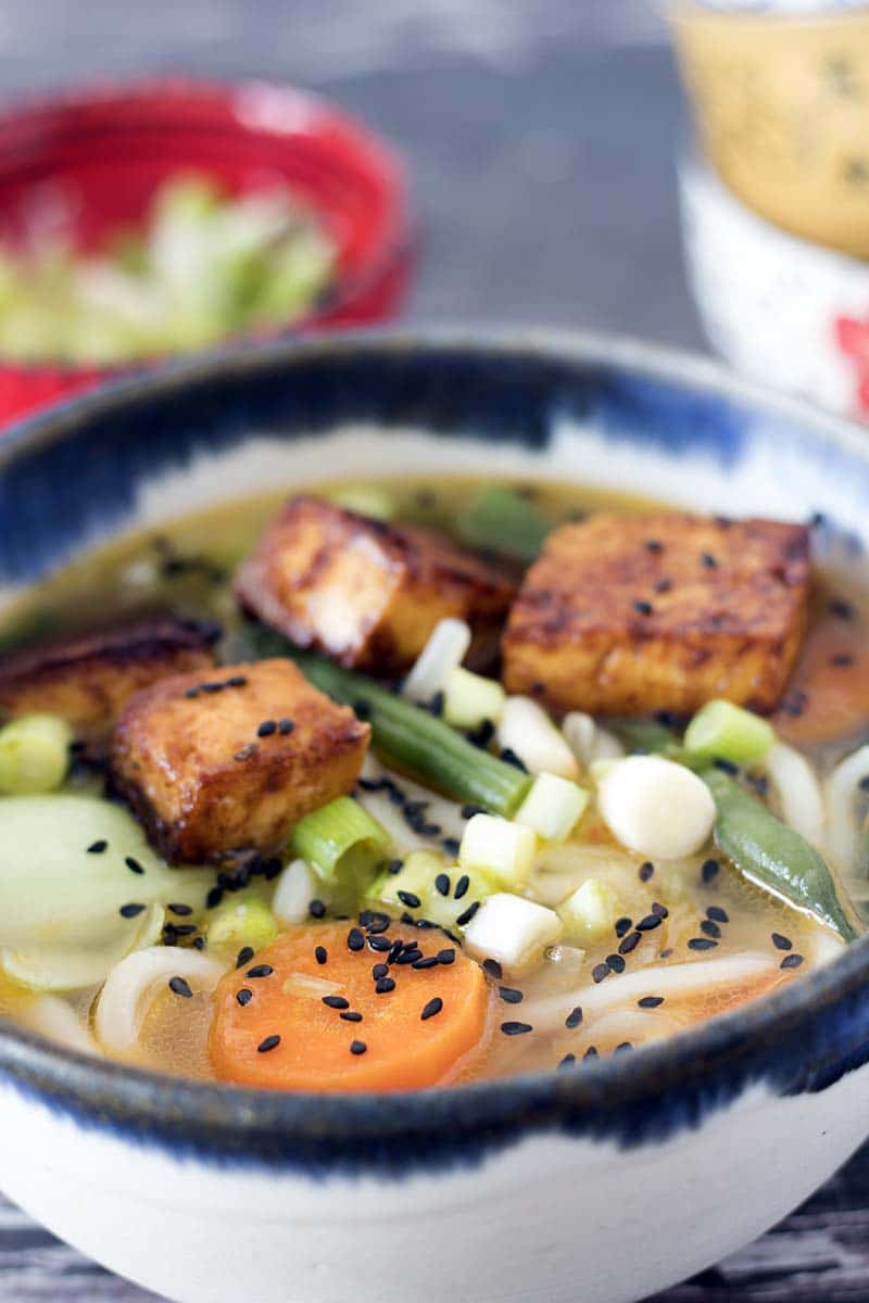 udon soup with miso and tofu in bowl