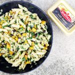Pasta with black beans, squash and corn in pan