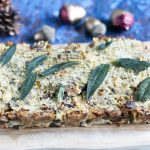 Parsnip and chestnut nut roast on board with sage leaves