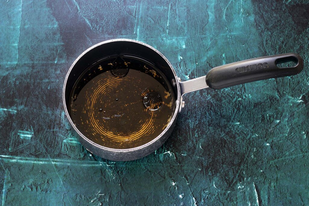 syrup, water and oil in small saucepan