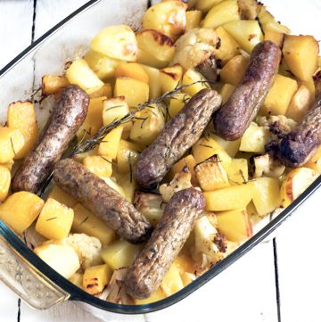 veggie sausage and root veg in roasting tin