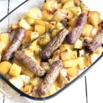 sausage traybake with cauliflower, potato and swede in glass dish