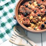 vegetarian meatballs made with aubergine in dish with gnocchi and olives