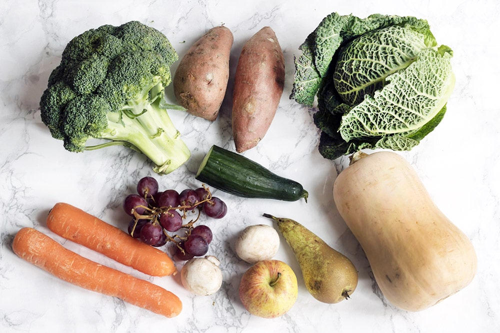 ten portions of fruit and veg on white background