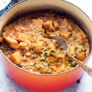 sweet potato and peanut stew in cast iron pan