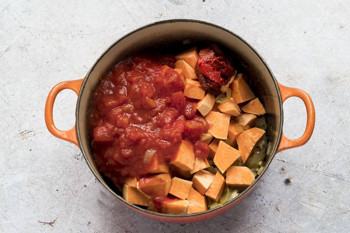 pan with chopped tomatoes, tomato puree and sweet potatoes