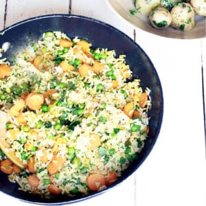vegetable pilau rice in pan with new potatoes in bowl