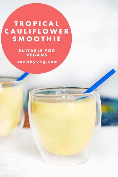 tropical cauliflower smoothie in glasses with blue straws