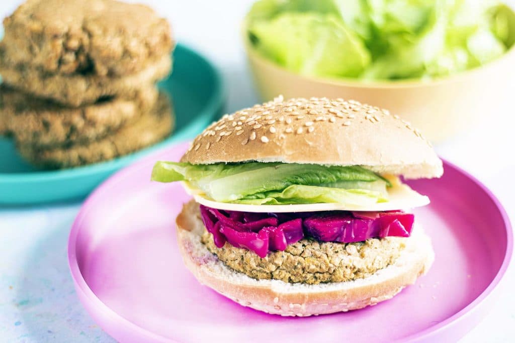 sweetcorn and chickpea burger on plate with fillings