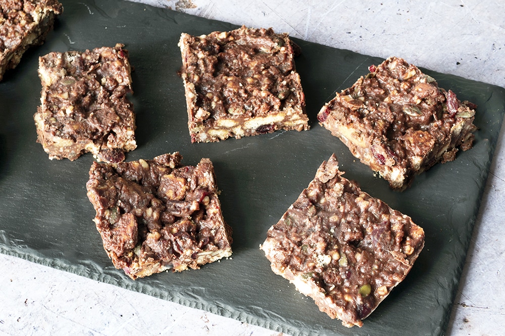 Christmas rocky road cut into squares on black slate plate