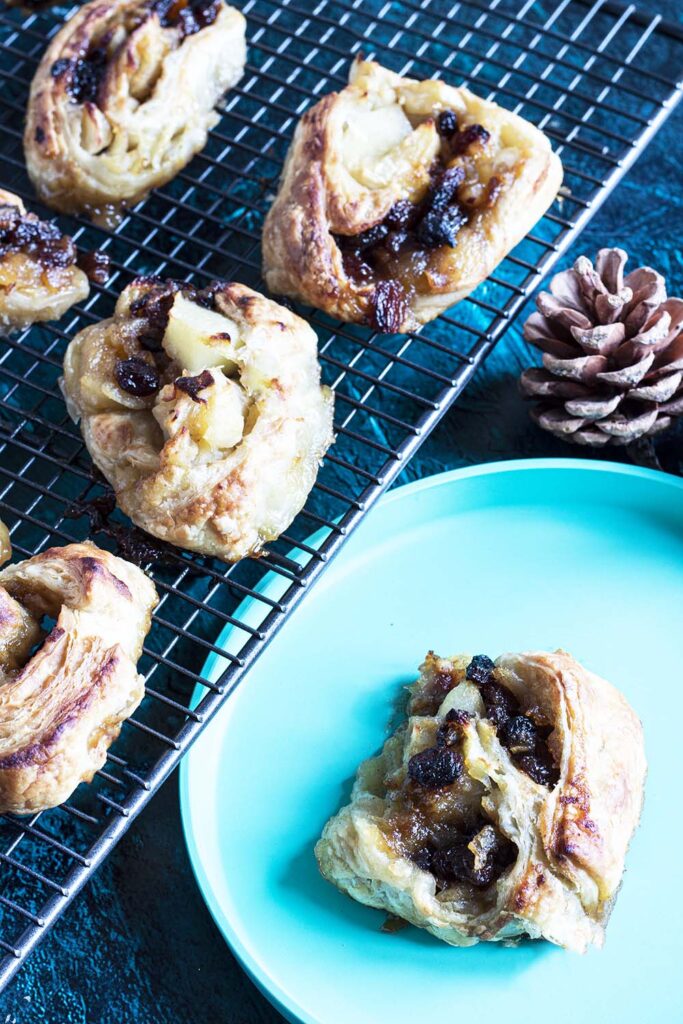 puff pastry pinwheels with Christmas mincemeat and apple on cooling rack and plate