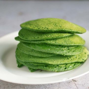 green pancakes stacked on white plate