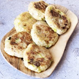 leek, pear and parsnip cakes on wooden platter