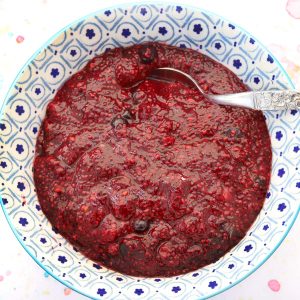 mixed berry chia seed jam in blue and white bowl