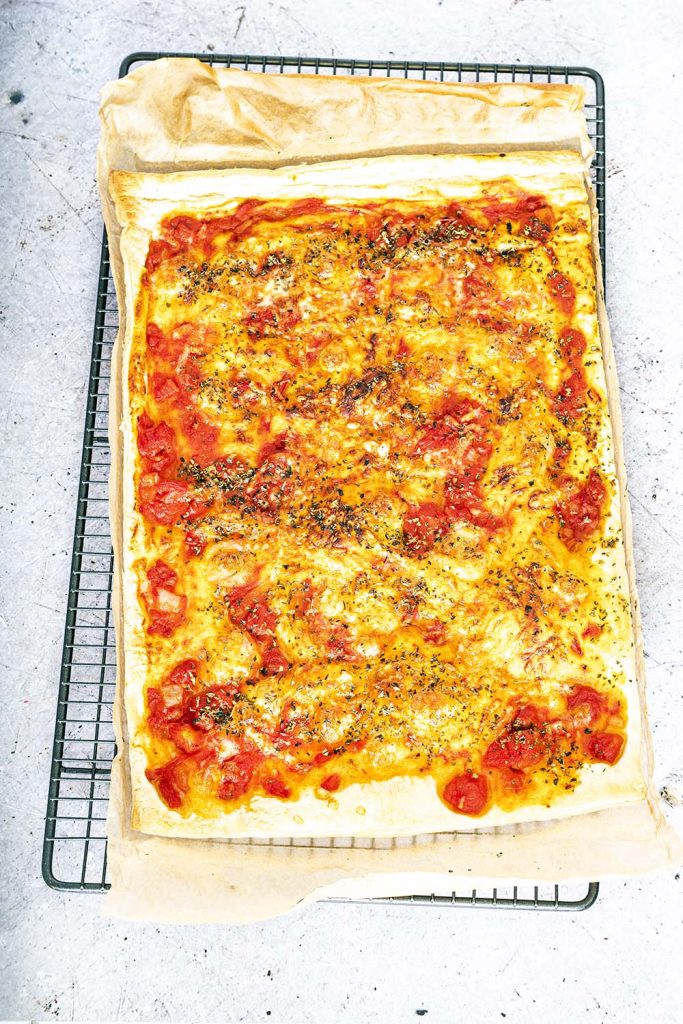 puff pastry pizza on cooling rack