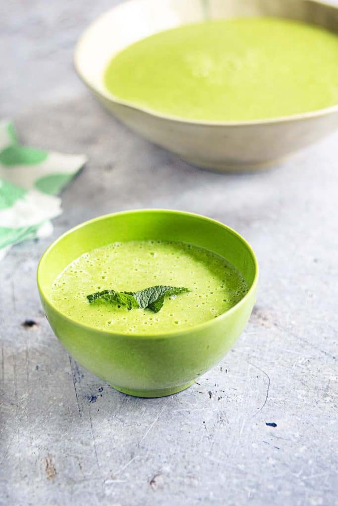 pea and mint soup in green bowl