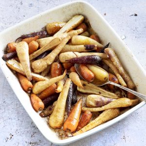 roasted carrots and parsnips in roasting tin