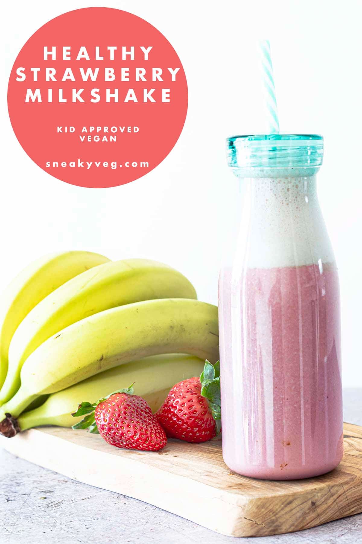 strawberry milkshake in bottle with fruit
