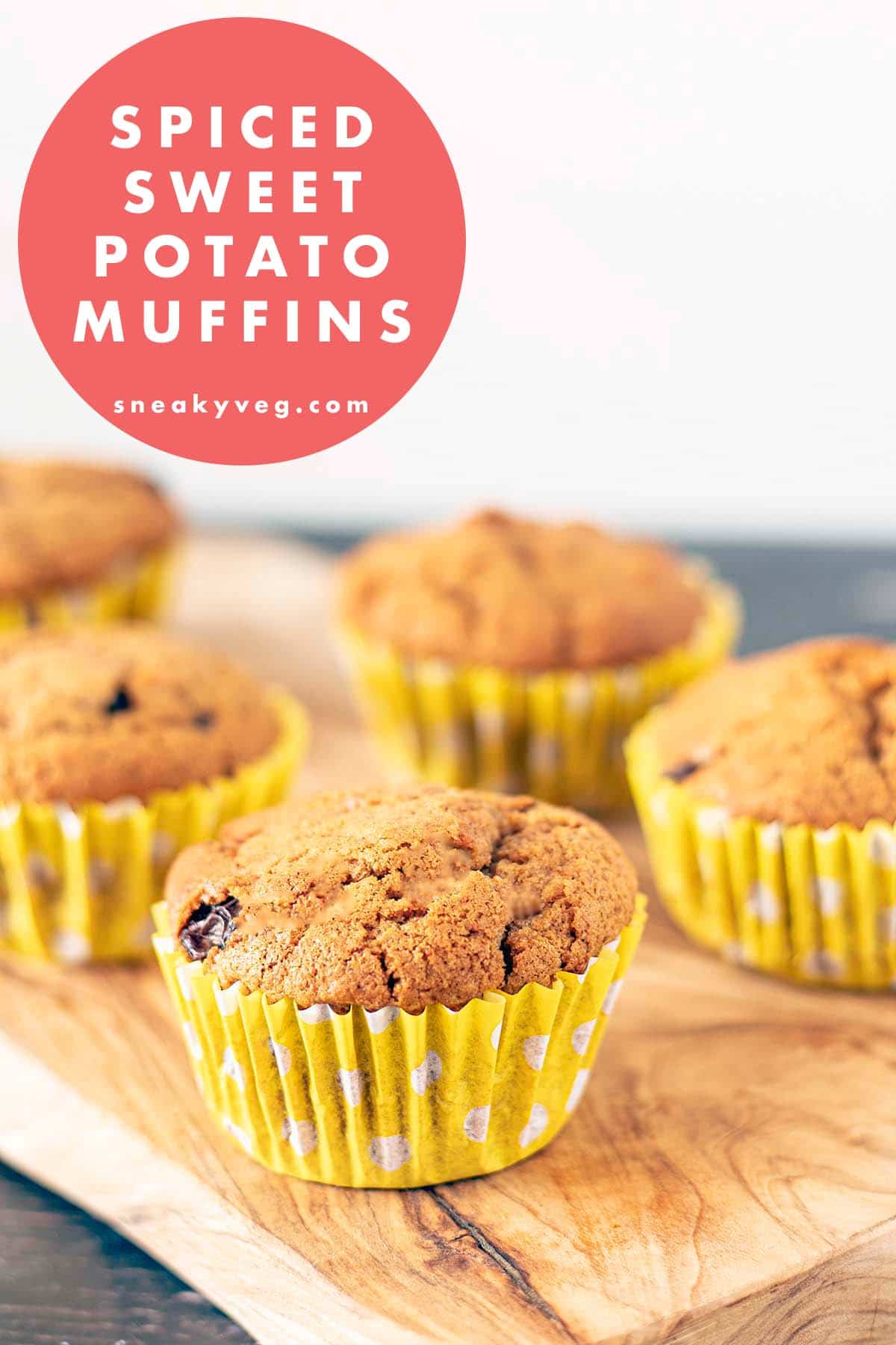 sweet potato muffins in yellow cases on board