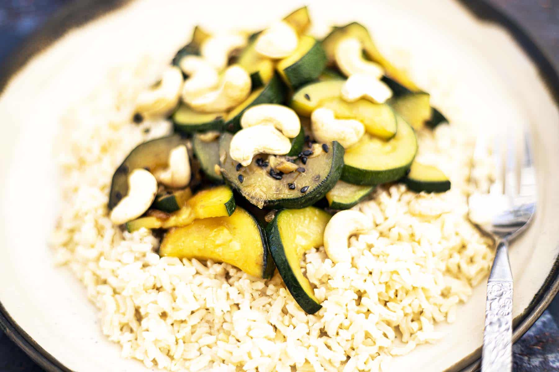 courgette stir fry with rice on plate