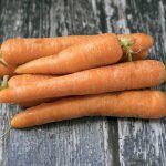 carrots on wooden background