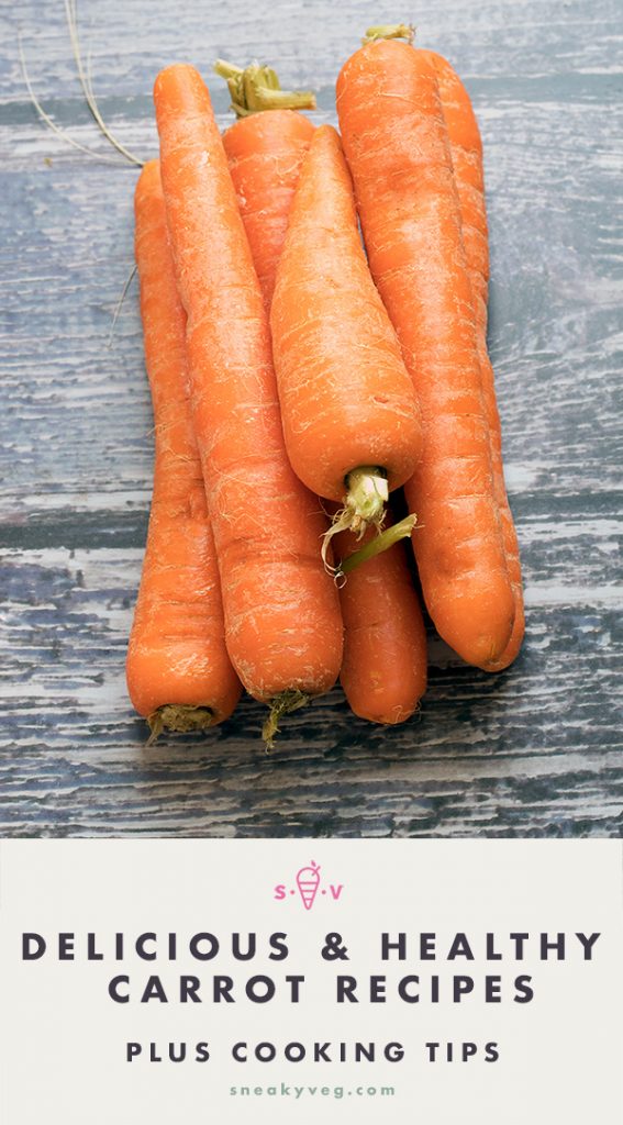 CARROTS ON WOODEN BACKGROUND