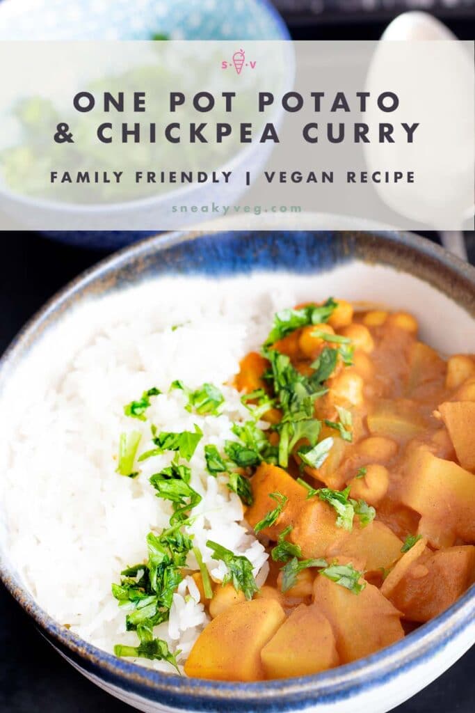 potato chickpea curry in bowl with rice and bowl of coriander in background