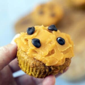 hand holding pumpkin muffin