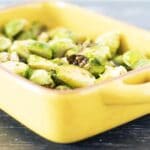 roasted brussels sprouts in yellow baking dish