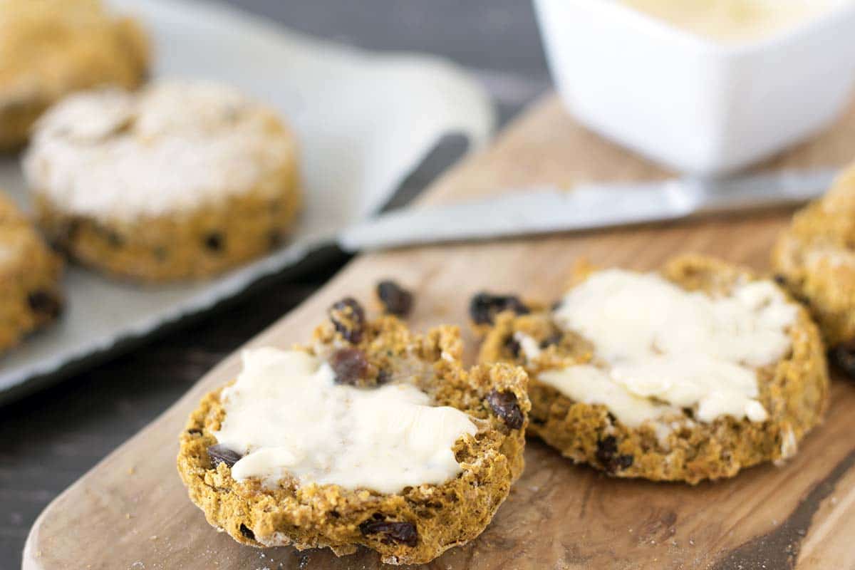 vegan pumpkin scones on board spread with butter