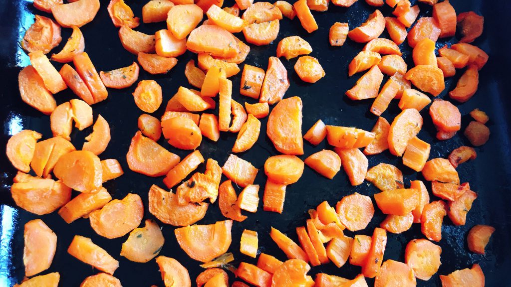 roasted carrots in roasting tin