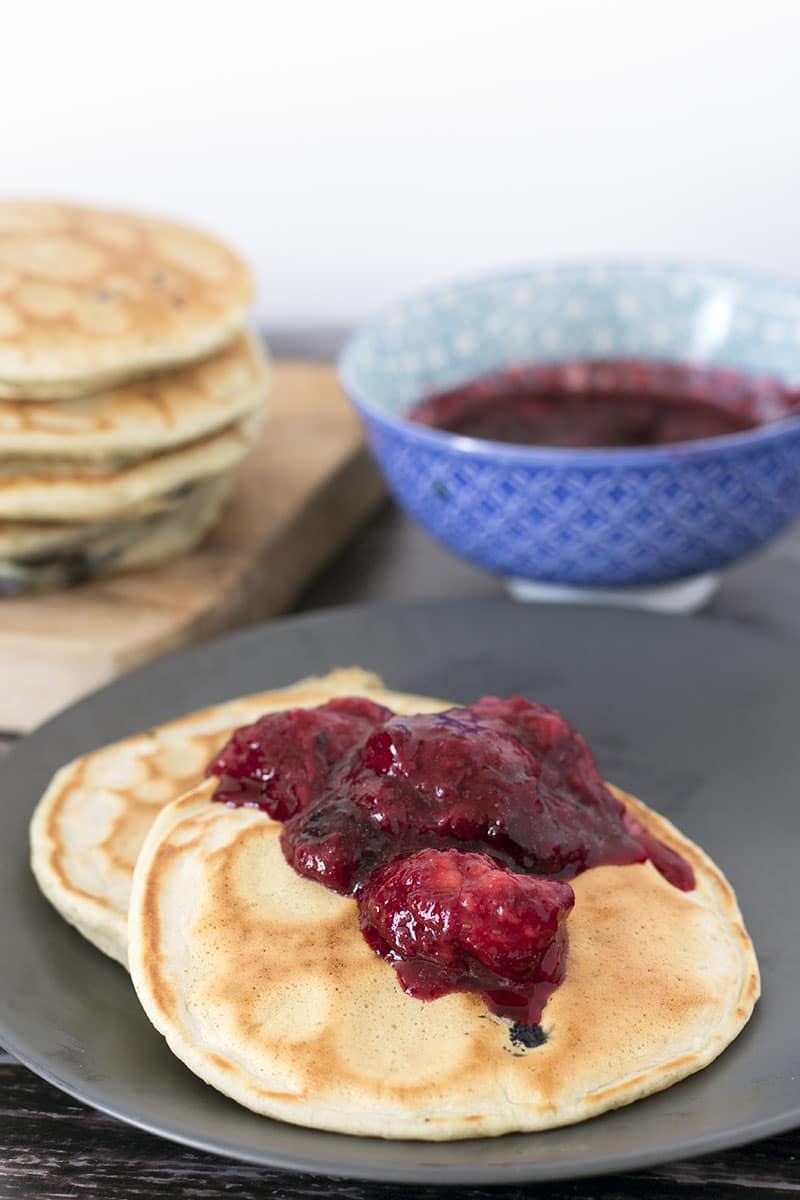 vegan pancakes on plate with fruit compote