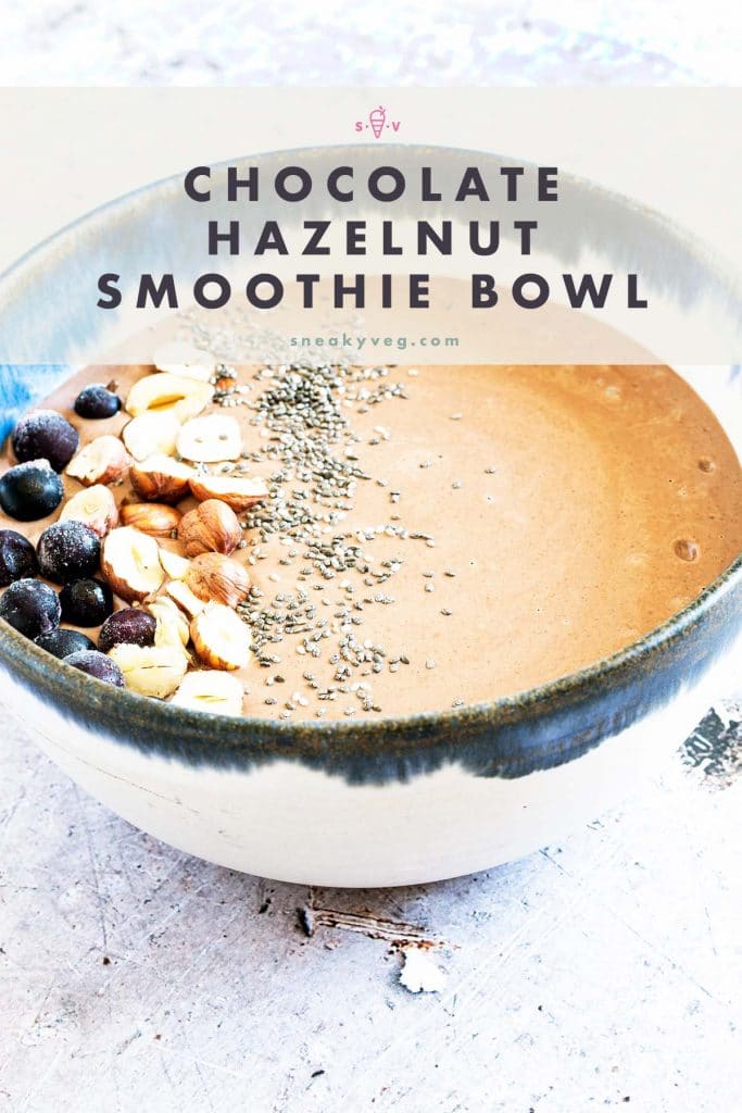 chocolate smoothie bowl with nuts, seeds and berries on top