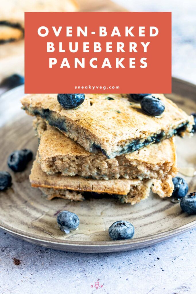 oven baked blueberry pancakes stacked on plate with blueberries
