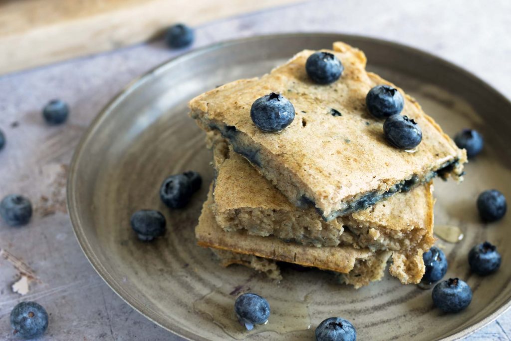 oven baked pancakes with blueberries on plate