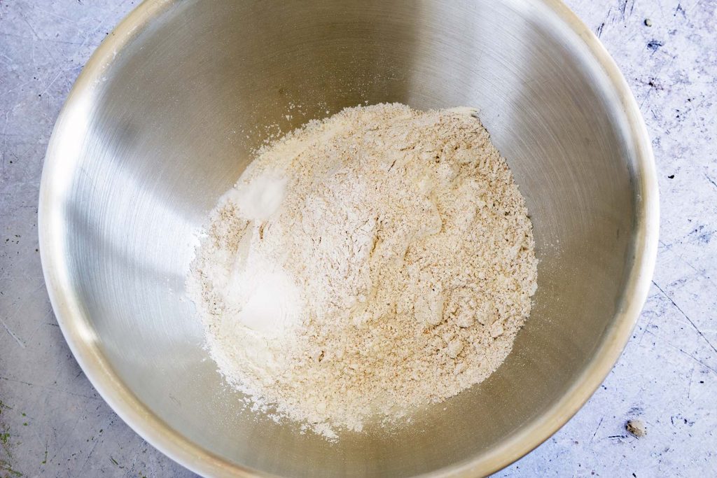 flour, baking powder and bicarbonate of soda in metal mixing bowl