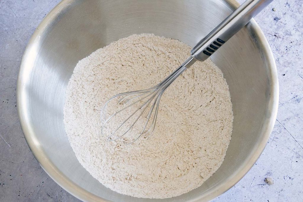 flour in mixing bowl with whisk
