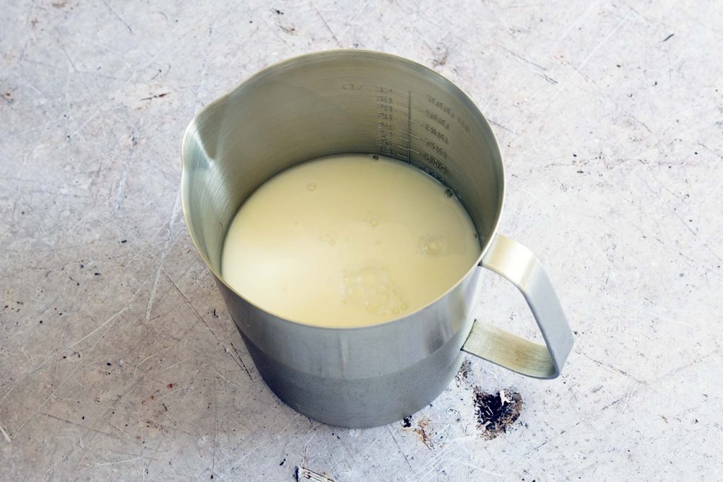 milk in metal jug