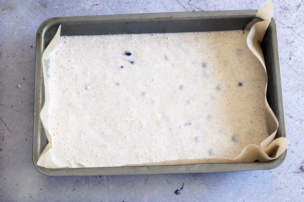 uncooked pancake batter in oven dish