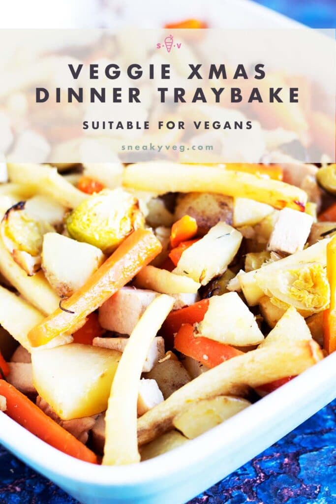 Christmas vegetables and vegan chicken pieces in blue and white oven tray