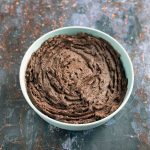 blue bamboo bowl filled with chocolate hummus