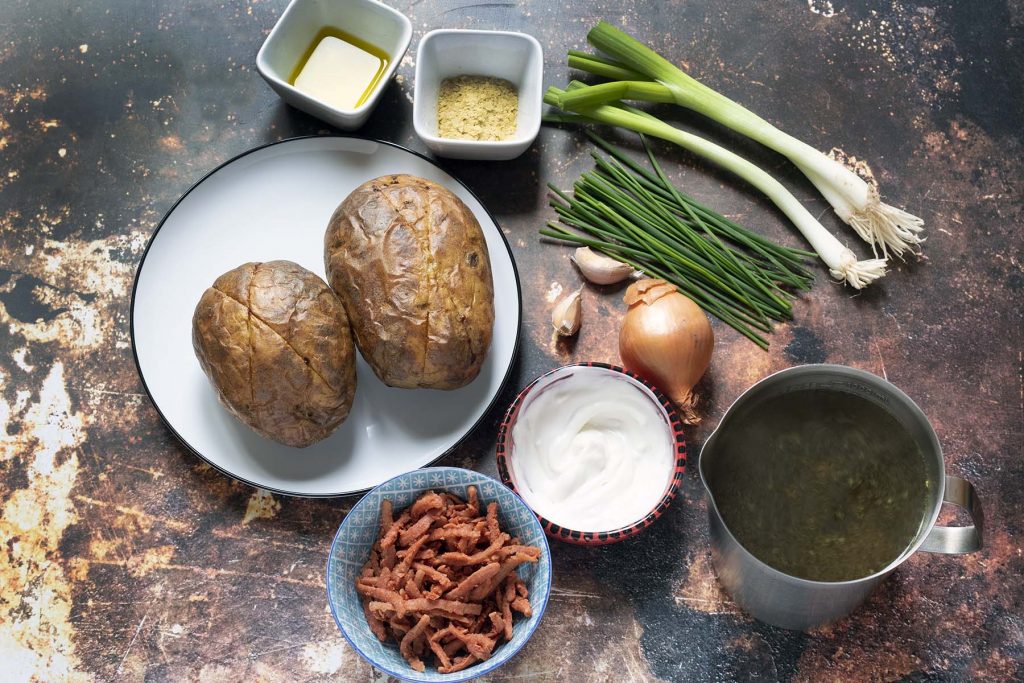 ingredients for baked potato soup on brown background