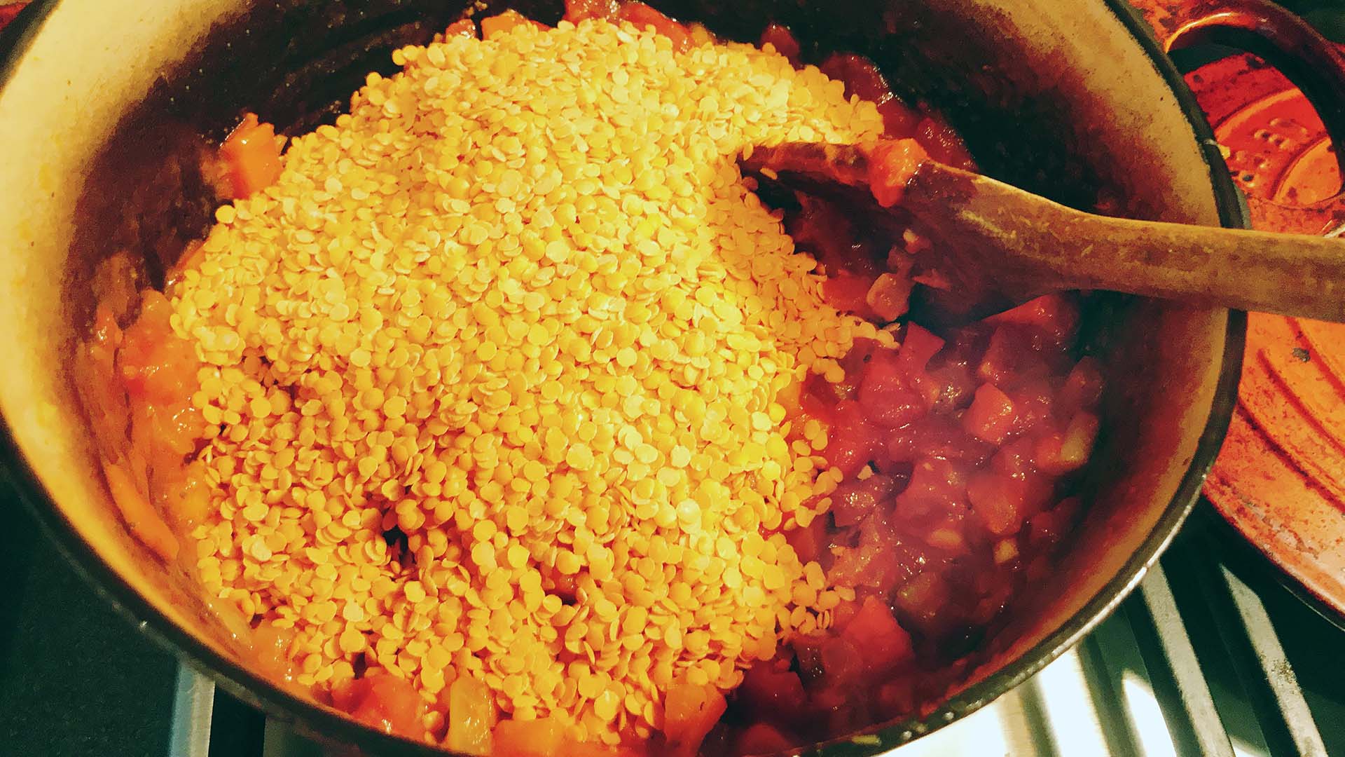 lentil bolognese being cooked in pan